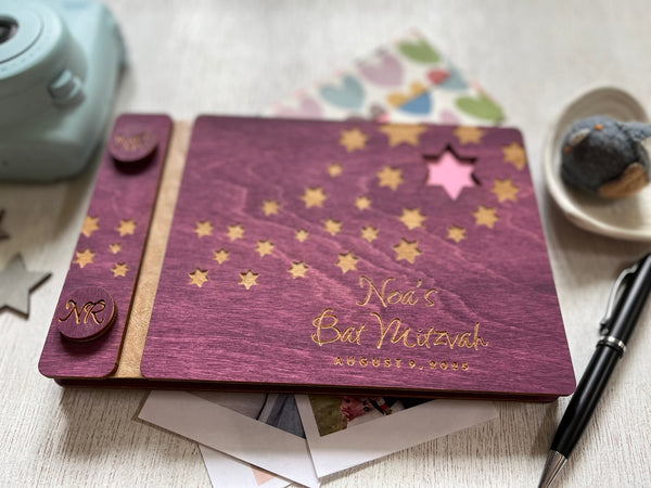 Purple book with star designs and personalized text made in wood for Bat or Bar Mitzvah