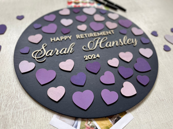 detail of retirement guest book alternative with purple hearts