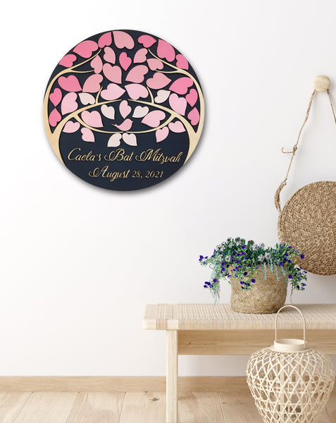 bat mitzvah guest book alternative in pink shades shown displayed in. a home