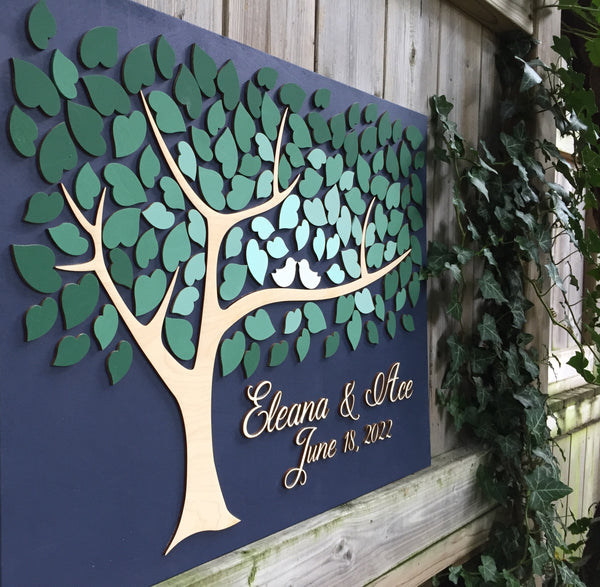 side view of green ombre wedding guest book alternative in 3D with tree and leaves to sign