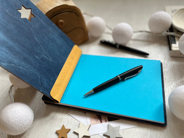 custom Bat mitzvah guest book with navy wooden covers and personalized engraved details and cutout star