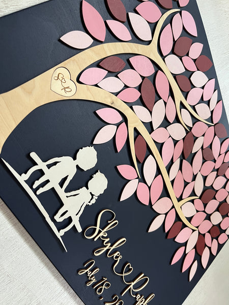 detail to show the couple silhouette on the guest book alternative personalized with your names and initials in tree and wedding date