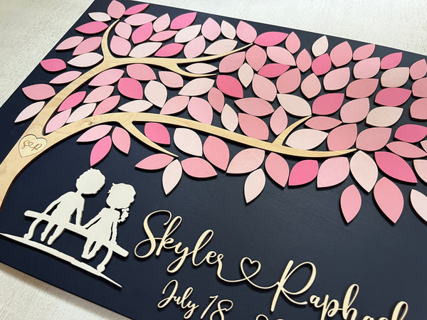 detail to show the couple silhouette on the guest book alternative personalized with your names and initials in tree and wedding date