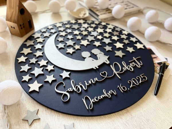 Decorative plate with star pattern, moon, and personalized text on a wooden surface.