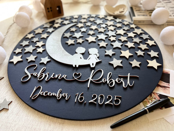 Round wedding guest book alternative with stars, moon and personalized names and wedding date on a navy blue background