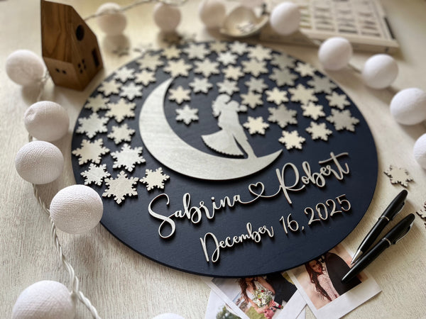 Decorative wall art with a couple on a moon and stars design, personalized with names and date.