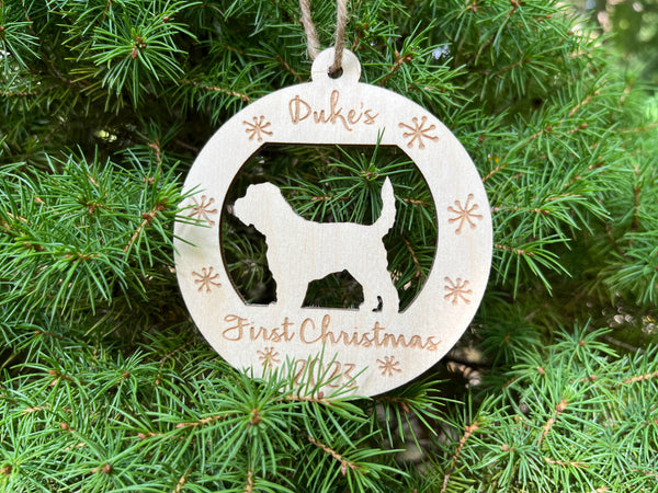 personalized puppy's first Christmas ornament round with golden doodle silhouette shown on a Christmas tree