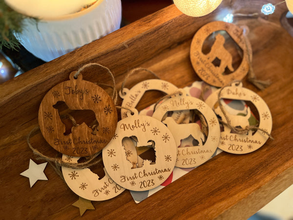 a bunch of puppy ornaments shown with different dog names and dog silhouettes