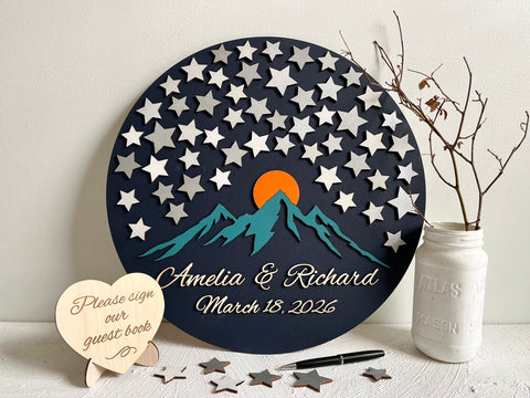 Decorative guest book with star pattern, mountains, and sunset design - round sign with stars for guests to sign