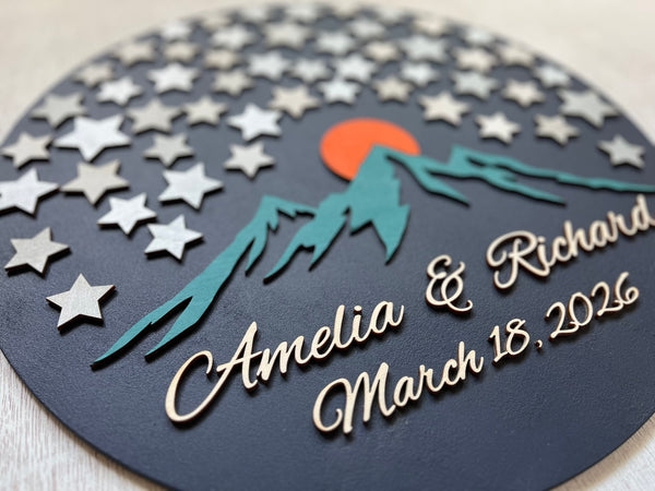Decorative guest book with star pattern, mountains, and sunset design - round sign with stars for guests to sign