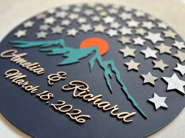 Decorative guest book with star pattern, mountains, and sunset design - round sign with stars for guests to sign
