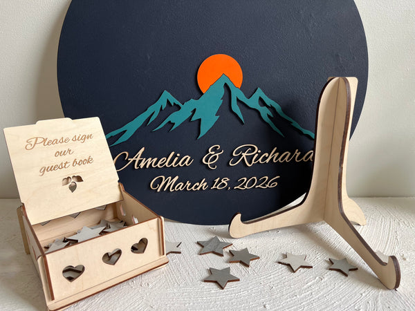 Personalized magnetic guest book with mountain design and wooden stand 