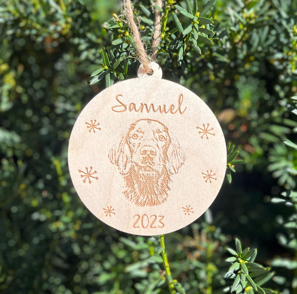 Golden retriever portrait engraved on a Christmas tree ornament