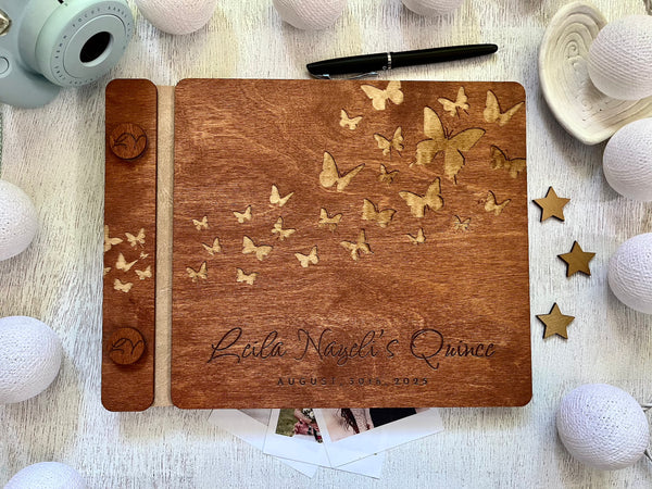 Wooden guest bookwith engraved text and butterfly design made for a Quince celebration, stained in brown wood stain