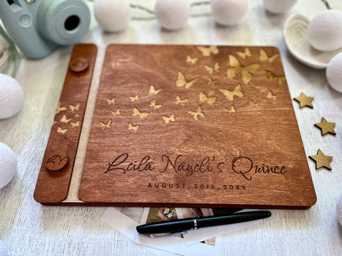 Wooden guest bookwith engraved text and butterfly design made for a Quince celebration, stained in brown wood stain