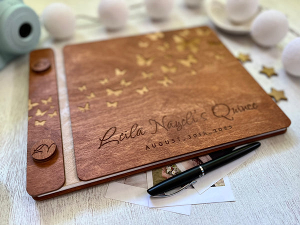 Wooden guest bookwith engraved text and butterfly design made for a Quince celebration, stained in brown wood stain