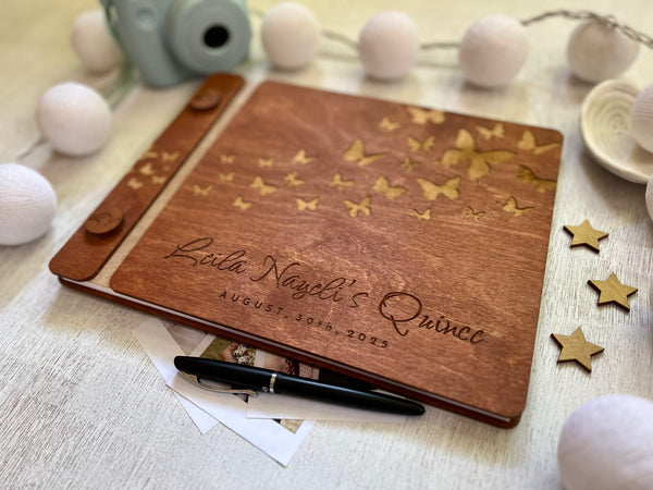 Wooden guest bookwith engraved text and butterfly design made for a Quince celebration, stained in brown wood stain