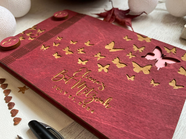 the cover is engraved with a multitude of butterflies and there is one cutout butterfly 