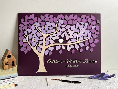 Decorative family tree guest book with purple leaf design for a family reunion 