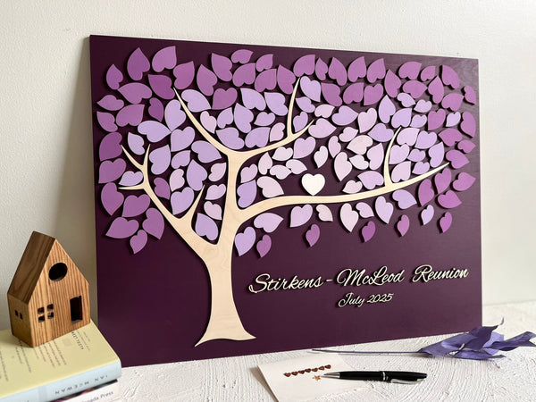 Decorative family tree guest book with purple leaf design for a family reunion 