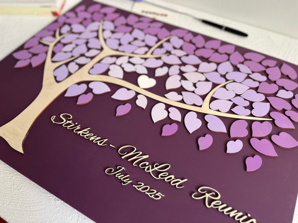 Decorative family tree guest book with purple leaf design for a family reunion 
