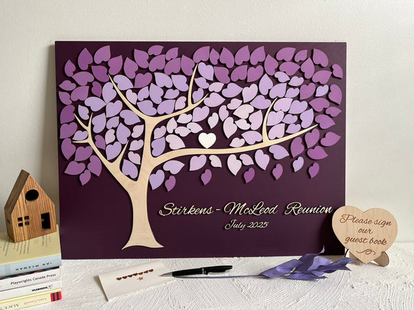 Decorative family tree guest book with purple leaf design for a family reunion 