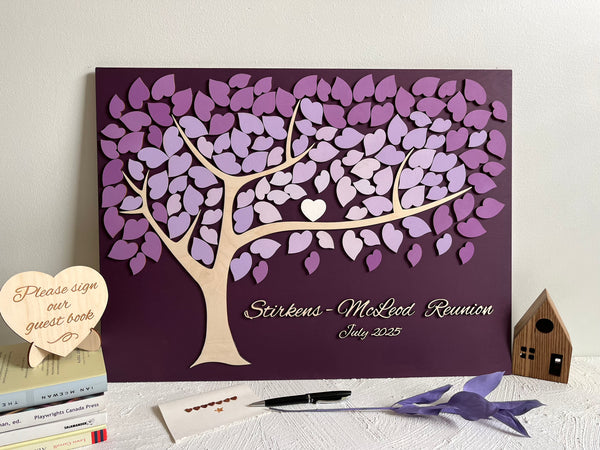 Decorative family tree guest book with purple leaf design for a family reunion 