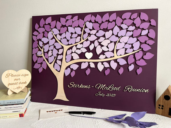 Decorative family tree guest book with purple leaf design for a family reunion 