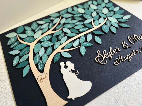 Decorative card with a tree and couple silhouette, featuring personalized names and dates.