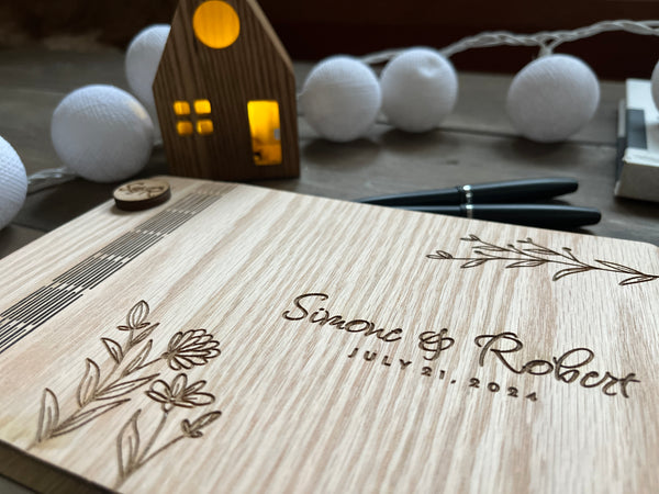 detail to show custom engraved details of wedding guestbook