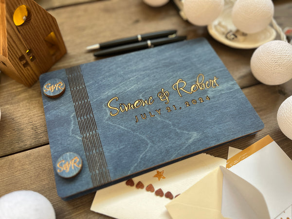 elegant wedding guest book with gold names and wedding date