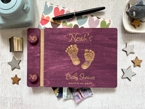 Baby shower guest book with footprints and personalized text on a wooden covers- with a violet wood stain and engraved baby foot prints with personalized text 