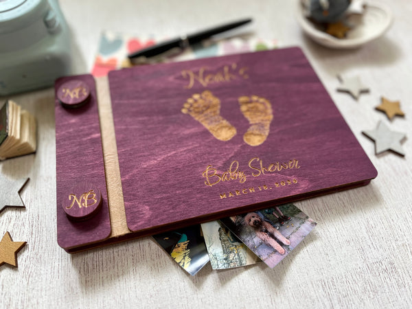Baby shower guest book with footprints and personalized text on a wooden covers- with a violet wood stain and engraved baby foot prints with personalized text 