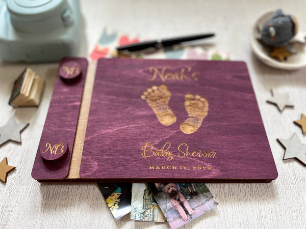 Baby shower guest book with footprints and personalized text on a wooden covers- with a violet wood stain and engraved baby foot prints with personalized text 