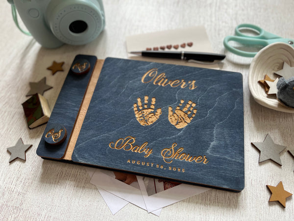 baby shower guest book with handprints with personalized name and buttons, made of wood with a navy blue stain and engraved handprints