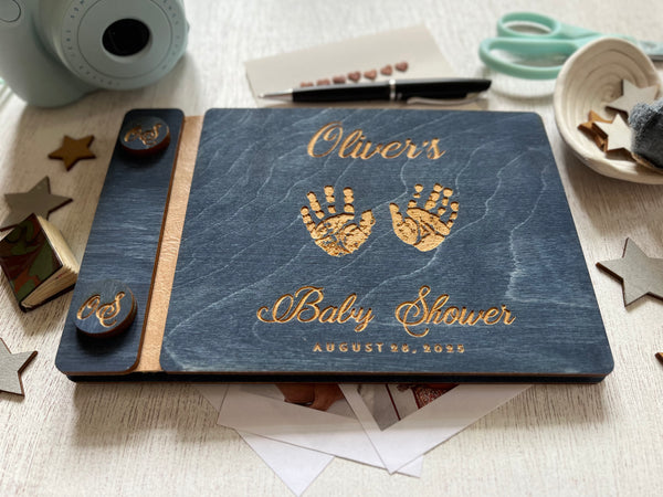baby shower guest book with handprints with personalized name and buttons, made of wood with a navy blue stain and engraved handprints