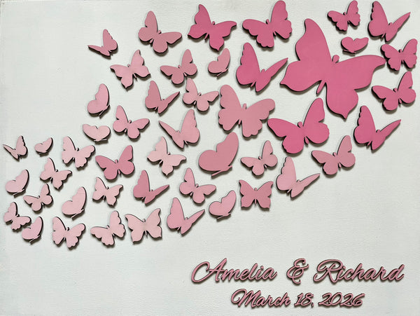 Butterfly wedding guest book with personalized names and date on a wood white board. The butterflies as well as the personalized text are all in pink but can be customized to reflect your preference. 