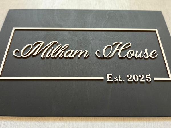 Decorative wood sign personalized with last names and 'Est. date' 