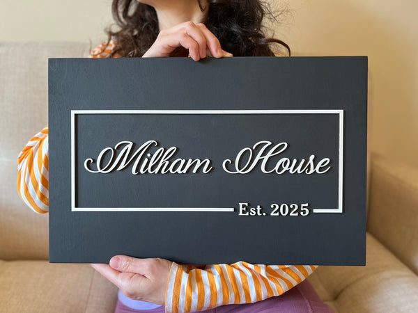 Decorative wood sign personalized with last names and 'Est. date' 