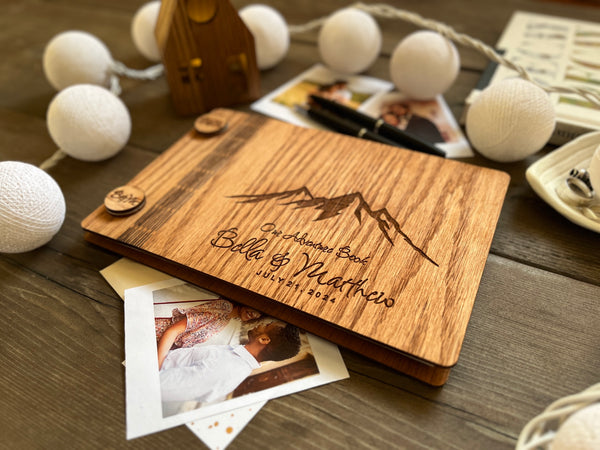 adventure book for newlyweds with engraved mountains and personalized names and wedding date