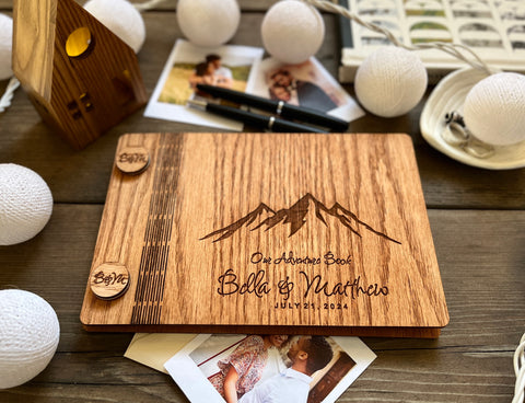 our adventure book wedding guest book with engraved mountains and names and wedding date