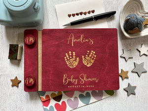 baby shower guest book with handprints with personalized name and buttons, made of wood with a burgundy stain and engraved handprints