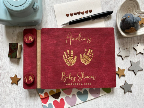 baby shower guest book with handprints with personalized name and buttons, made of wood with a burgundy stain and engraved handprints