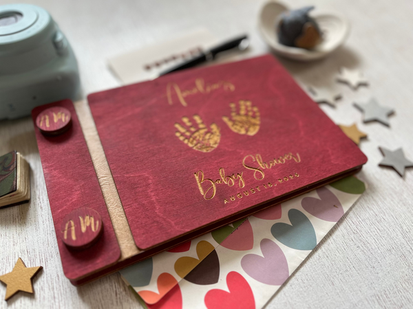 Burgundy baby shower guest book with engraved text  and baby handprints