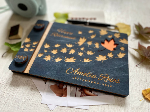 Personalized retirement guest book with autumn leaf design on a custom engraved surface with maple leaves and  personalized with the name of the retiree and the text "Happy Retirement"
