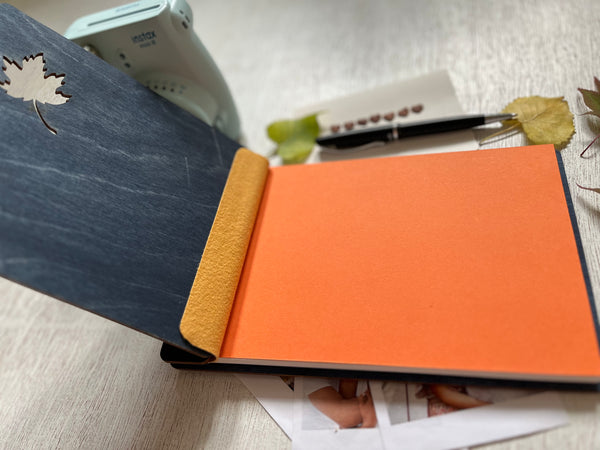 the interior of the Personalized retirement guest book with autumn leaf design on a custom engraved surface with maple leaves and  personalized with the name of the retiree and the text "Happy Retirement"