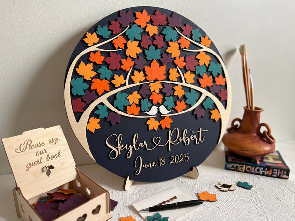 Magnetic guest book with maple leaves for wedding guests to sign  and personalized text, with a holder and box for the leaves