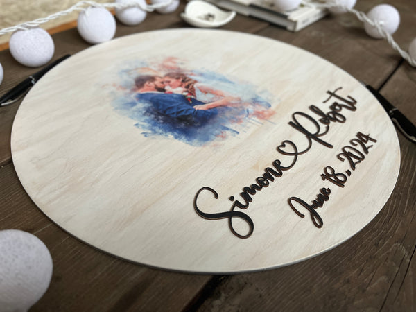 detail of round wood sign with splatter portrait of newlyweds