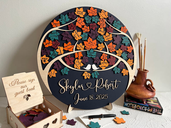 Magnetic guest book with maple leaves for wedding guests to sign  and personalized text, with a holder and box for the leaves