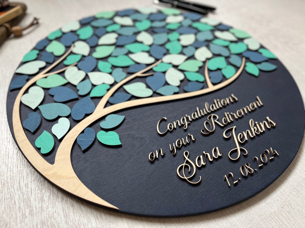 the retirement party guests each sign a leaf for a lasting memory and a board suitable for home decor